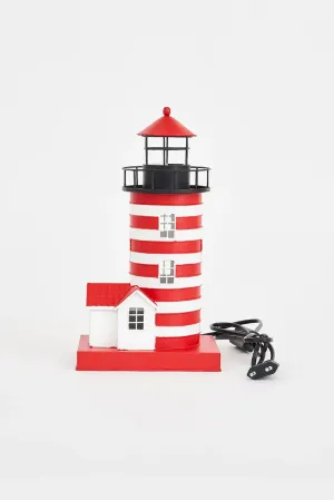 Faro de metal con casa