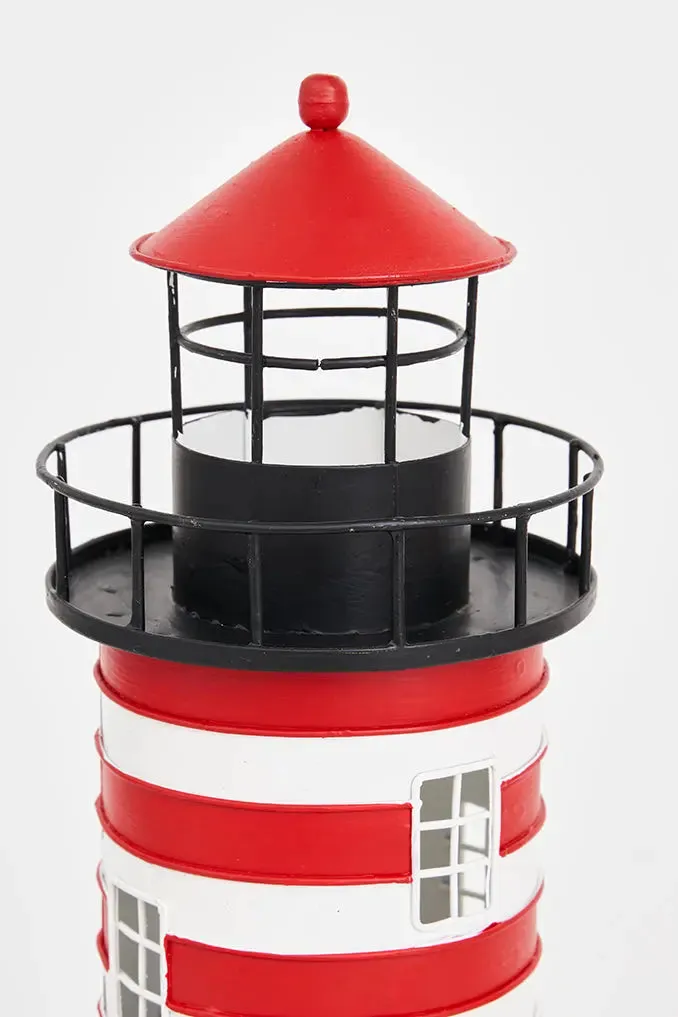 Faro de metal con casa