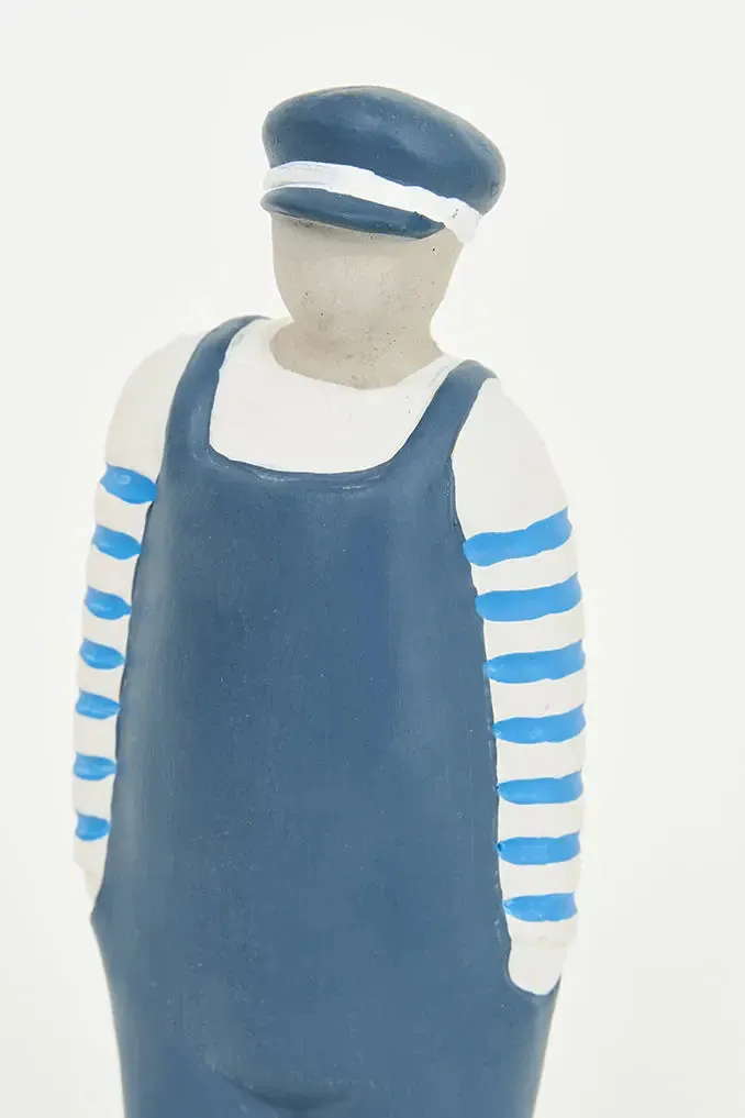 Figura de Marinero de cemento con peto y gorra azul