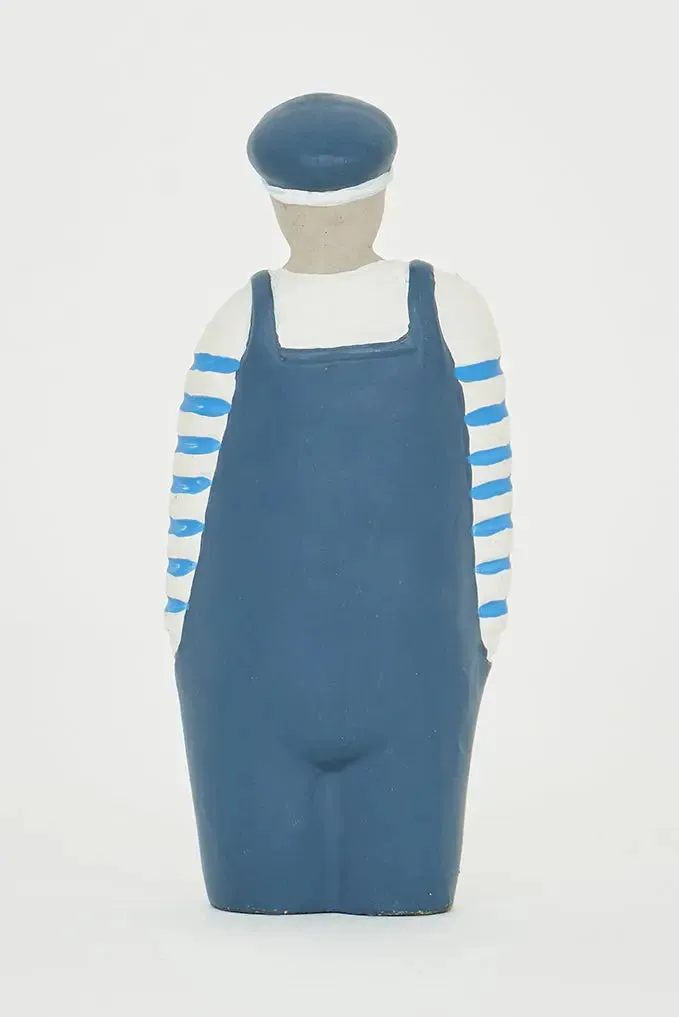 Figura de Marinero de cemento con peto y gorra azul