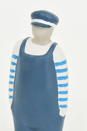Figura de Marinero de cemento con peto y gorra azul